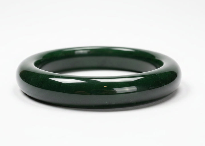 Green jade bangle on a white background 