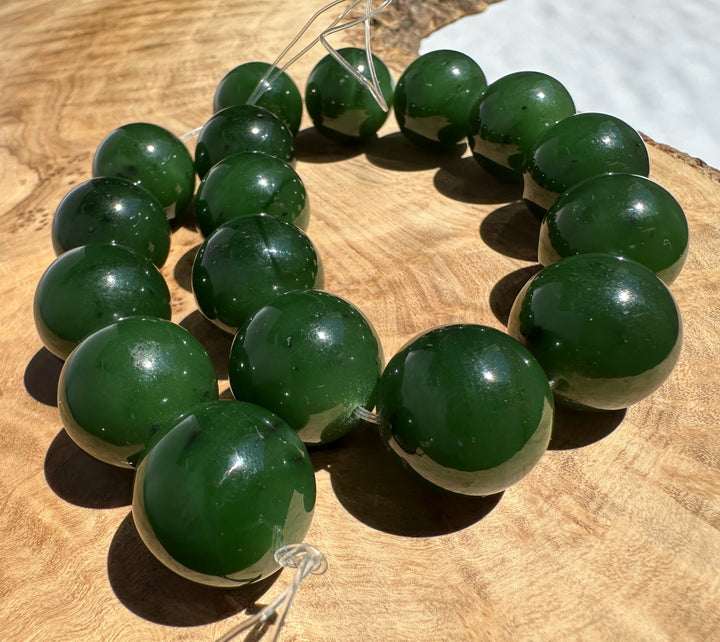 Green beads on a wooden surface