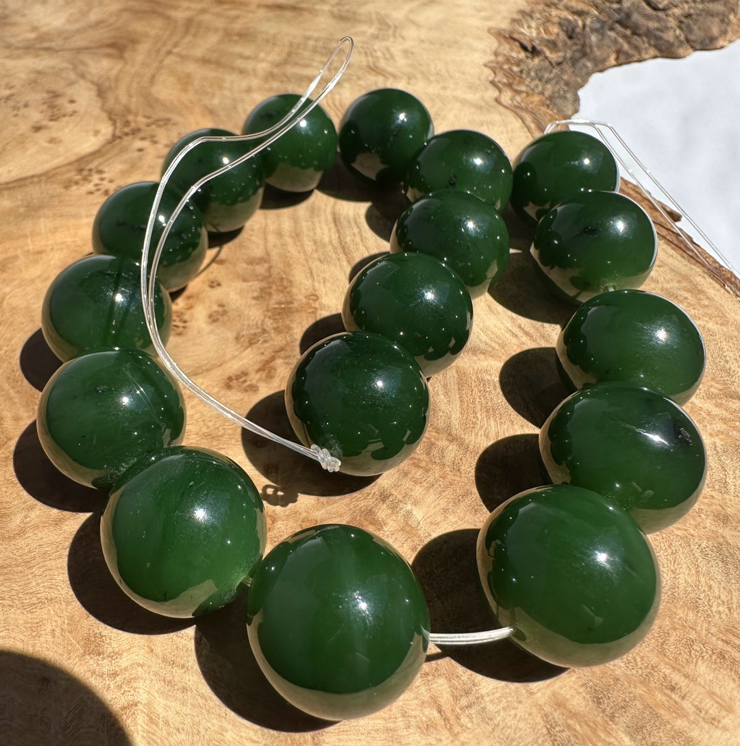 Green beads on a wooden surface