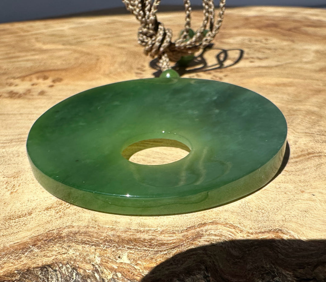 green jade on wooden base