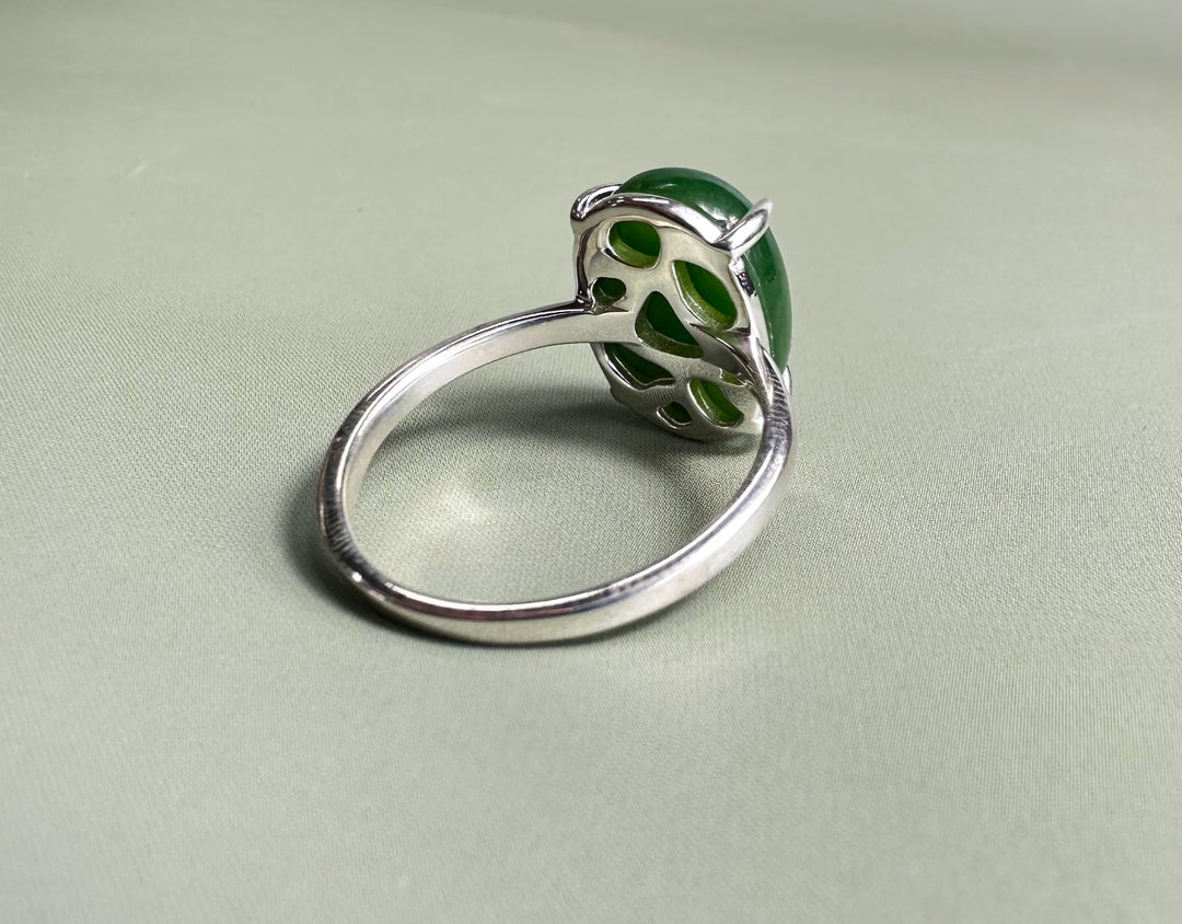 Side view of Canadian Jade and Silver Ring with a green jade cabochon and decorative silver backing.
