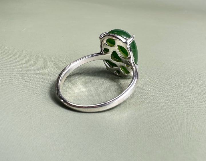 Side view of Canadian Jade and Silver Ring with a green jade cabochon and decorative silver backing.