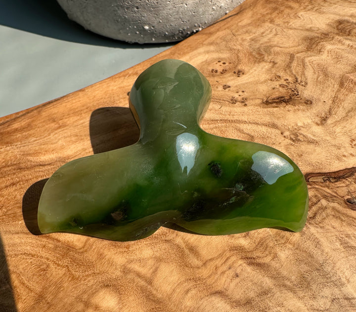 Polar Jade whale drawer pull 3 inches in green tones with a smooth polished finish on a wooden surface.