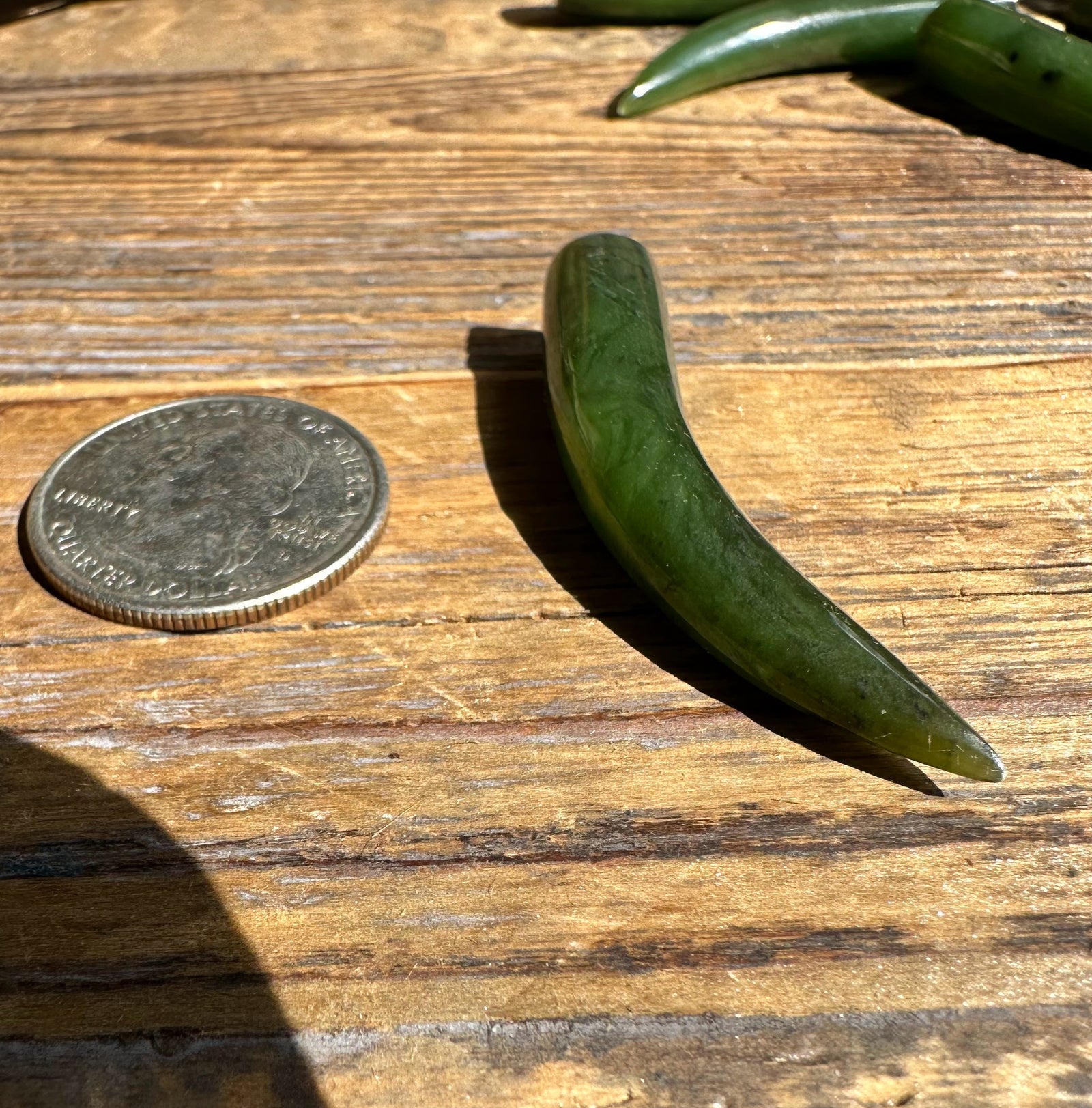 Jade Talon 44mm sold individually beside a coin for scale on a wooden surface.