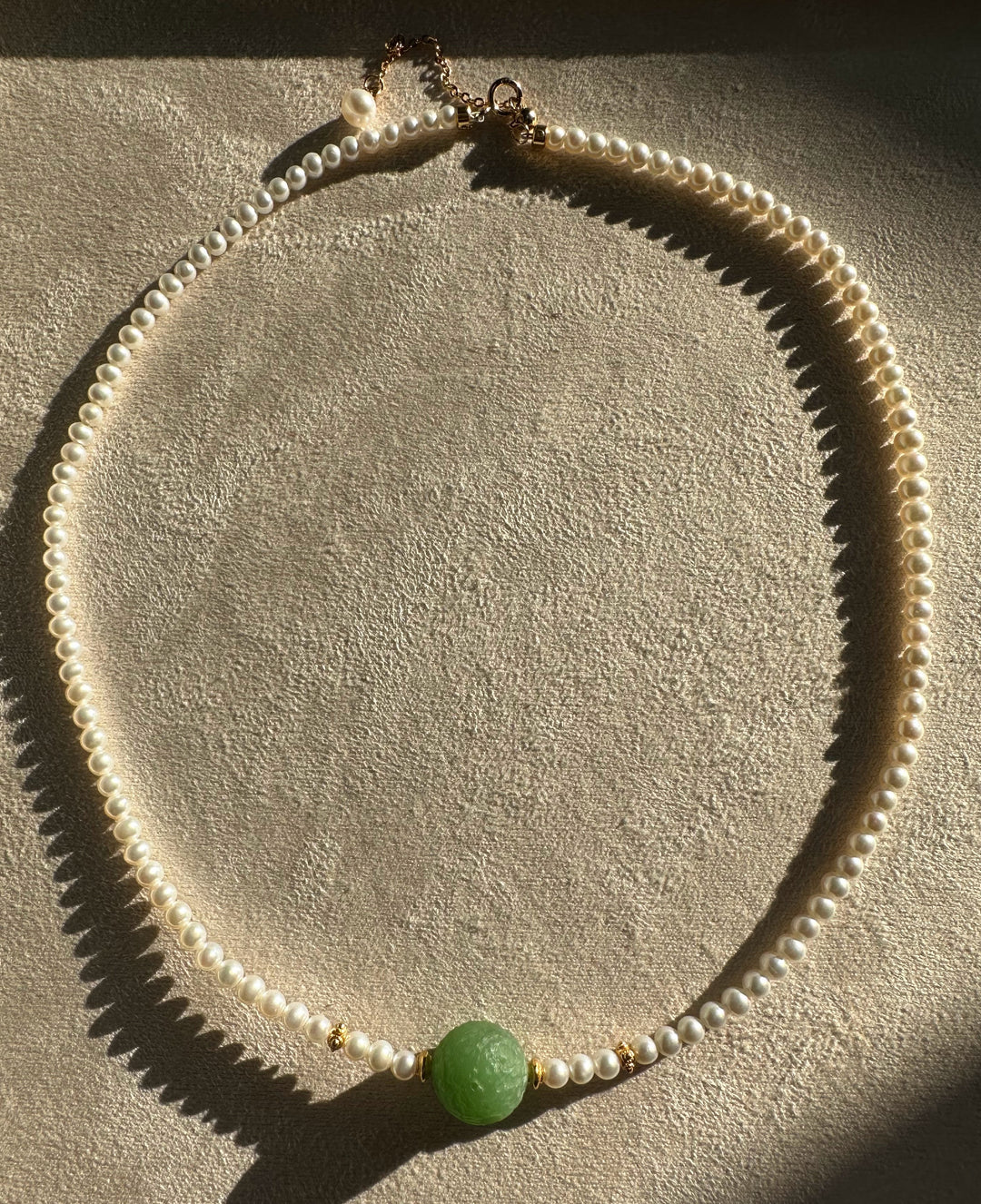 Siberian and Pearl Necklace with a vivid green centerpiece bead and pearl strand