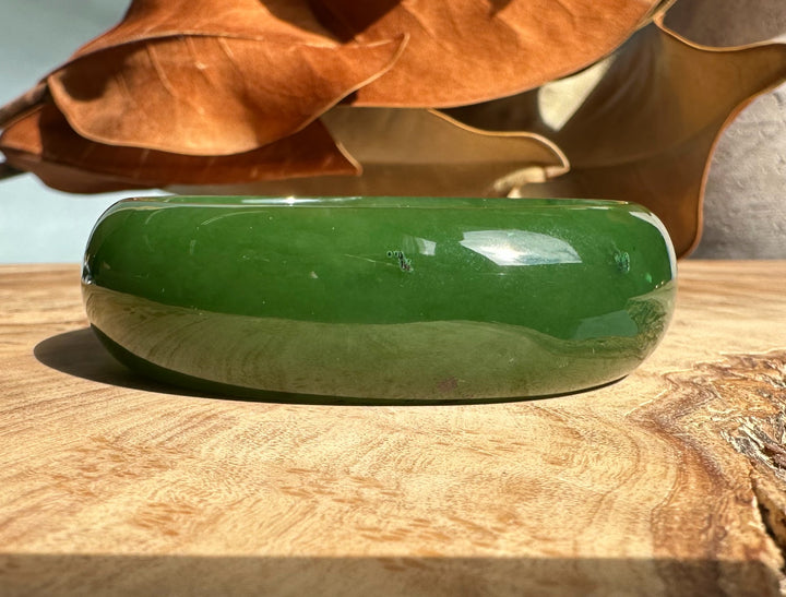 A+ Canadian Jade oval bangle in glossy green with a smooth polished surface 52.5 mm