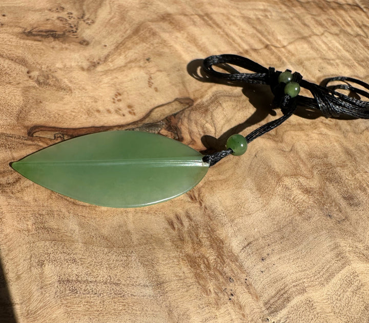 Siberian Jade Leaf Pendant on a black braided cord with green bead accents, 42mm leaf.