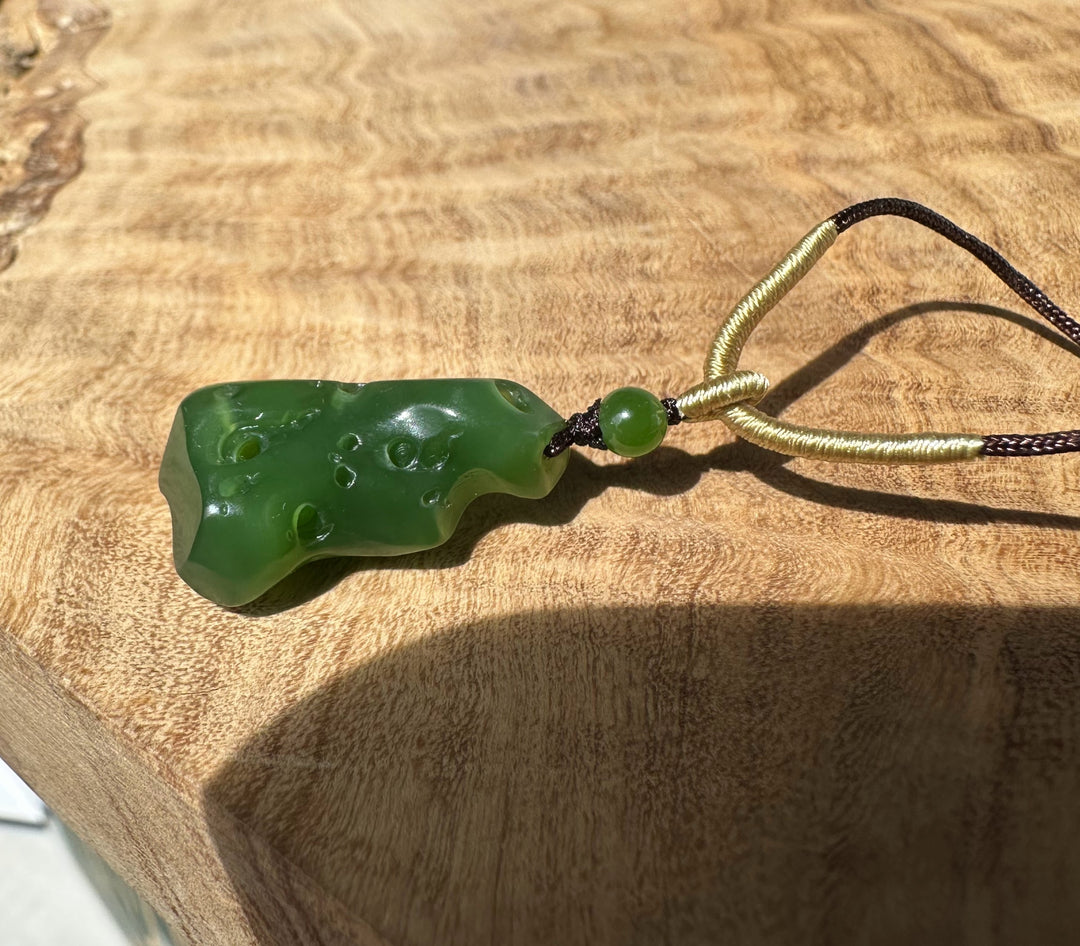 Rich green Siberian abstract pendant on black and pale gold braided cords
