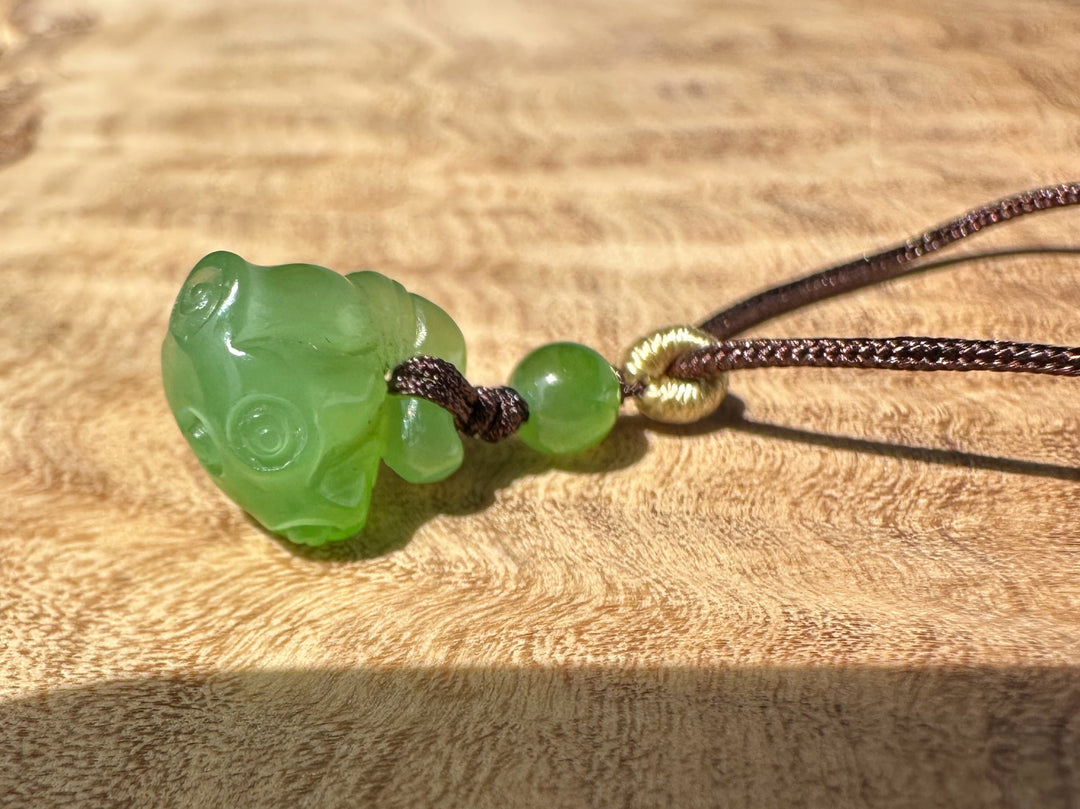 Apple Siberian Jade lotus seed pod pendant with extra small 9.5mm bead on dark cord