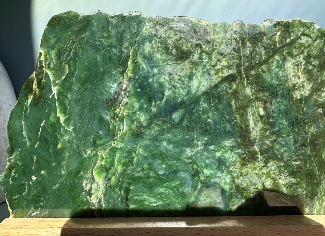 Canadian Jade Slab on base 9.25 inches showing deep green stone with lighter veins and rugged edges