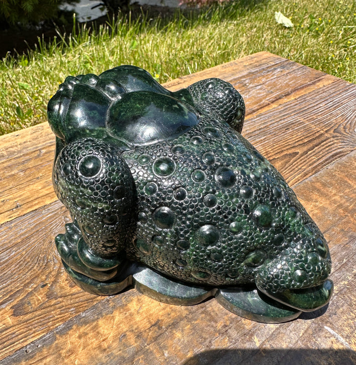 Top view of the dark green Ogden Jade Toad sculpture showing bubble textured skin and glossy finish.