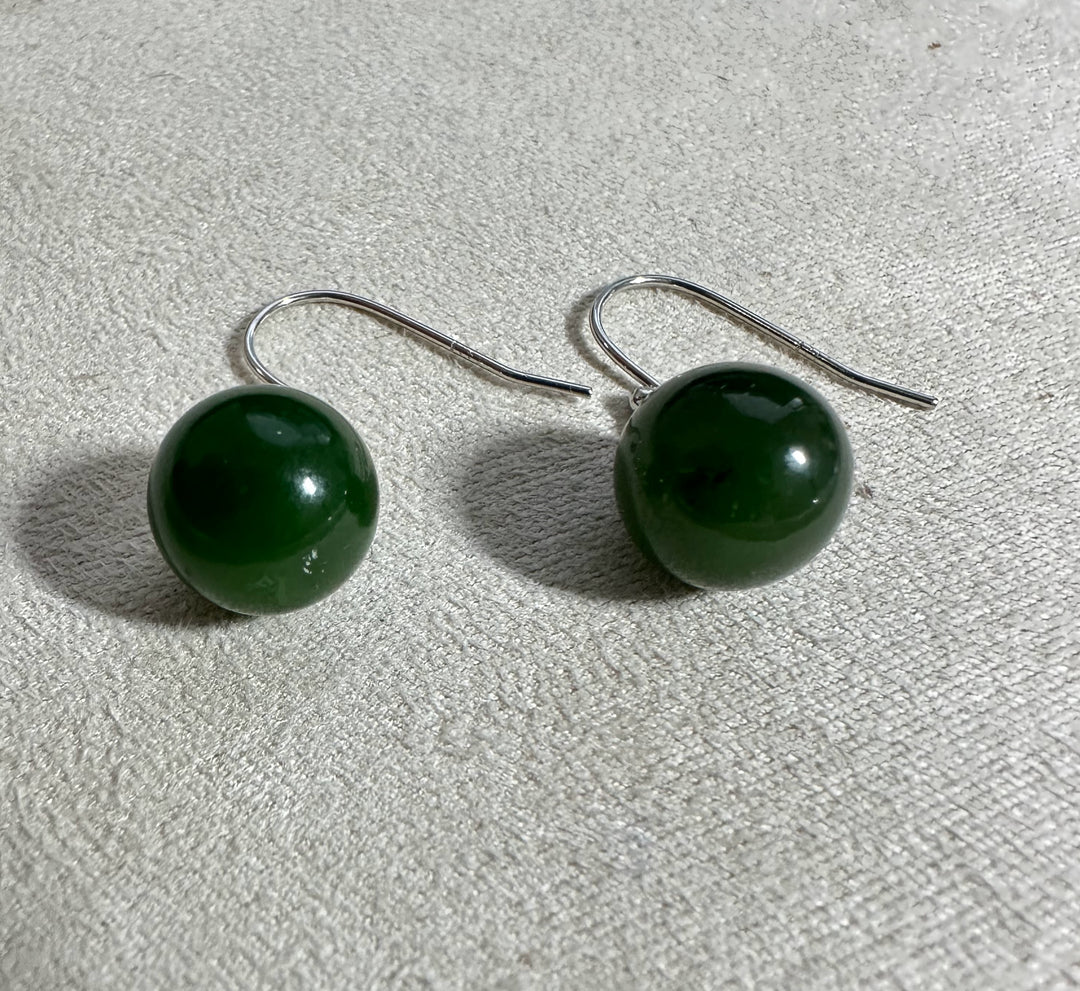 Green jade sphere earrings with silver hooks