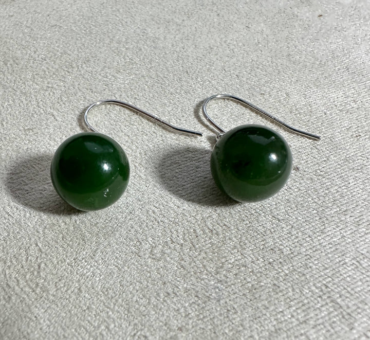 Green jade sphere earrings with silver hooks