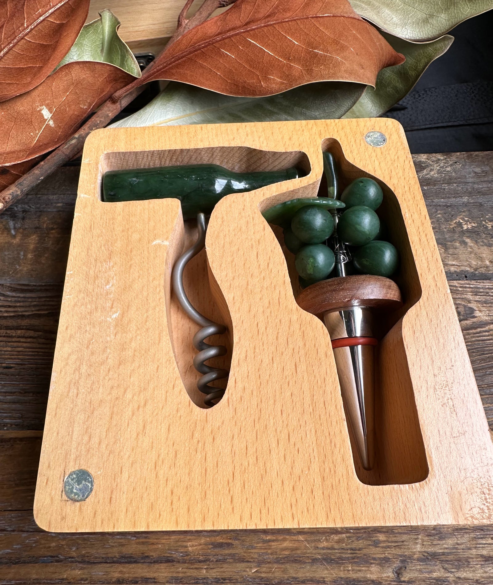 Open Jade Wine Set in a carved wooden tray showing the green bottle corkscrew and grape cluster
