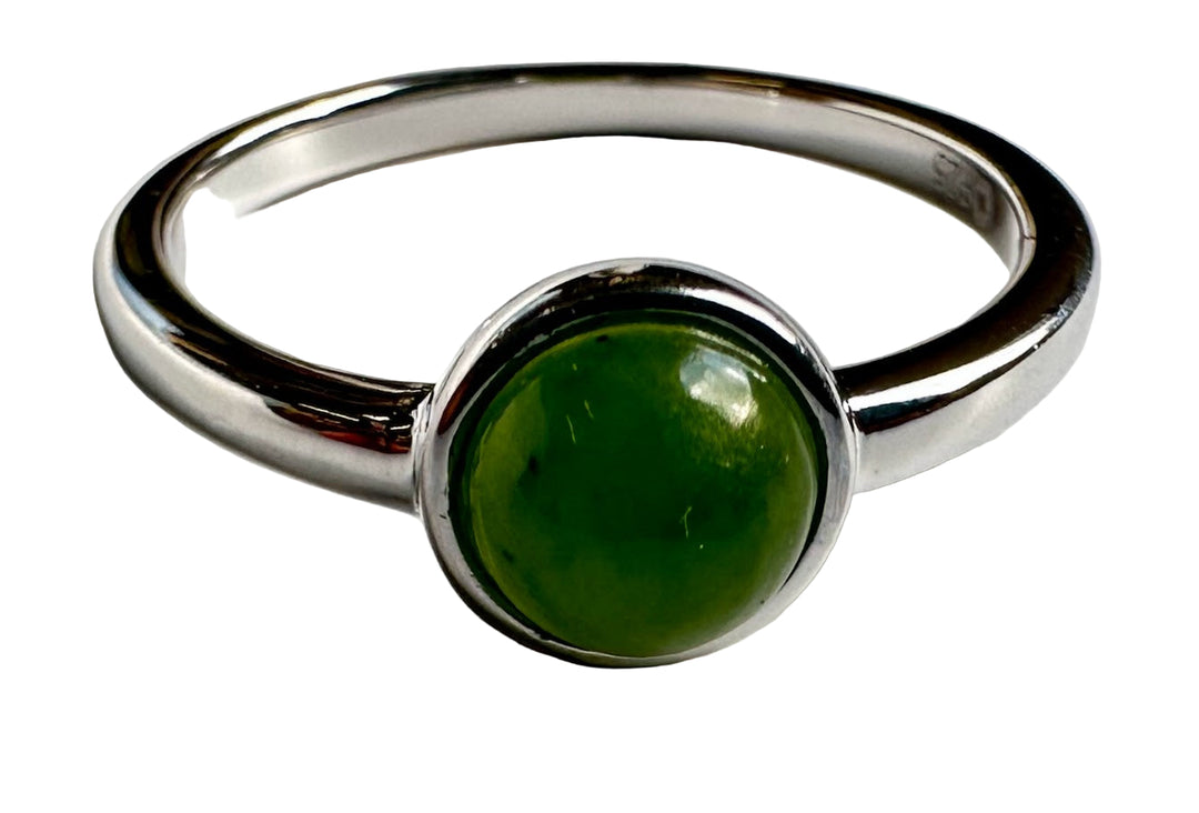 Close-up of Jade and Silver Ring showing a round green jade cabochon in a silver bezel.
