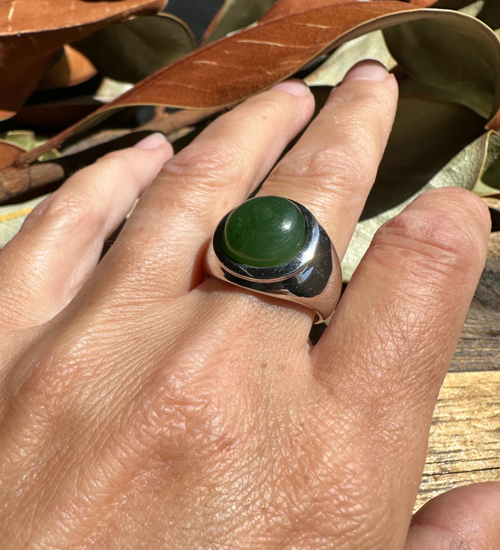 Canadian Jade Ring featuring a green jade cabochon set in a bold silver bezel on the finger