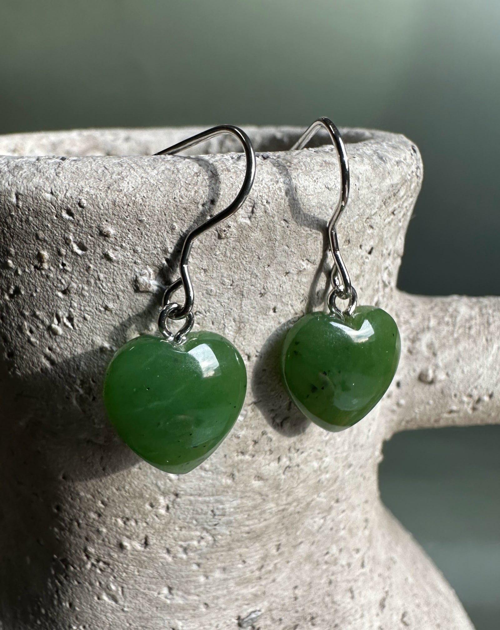 Green jade heart earrings with silver hooks