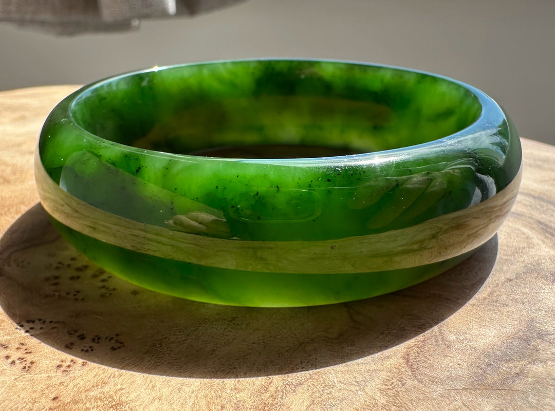 Top view of jade bangle showing the hollow interior and bright green glaze
