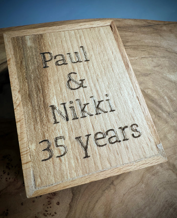 Wooden gift box lid engraved with Paul &amp; Nikki 35 years.
