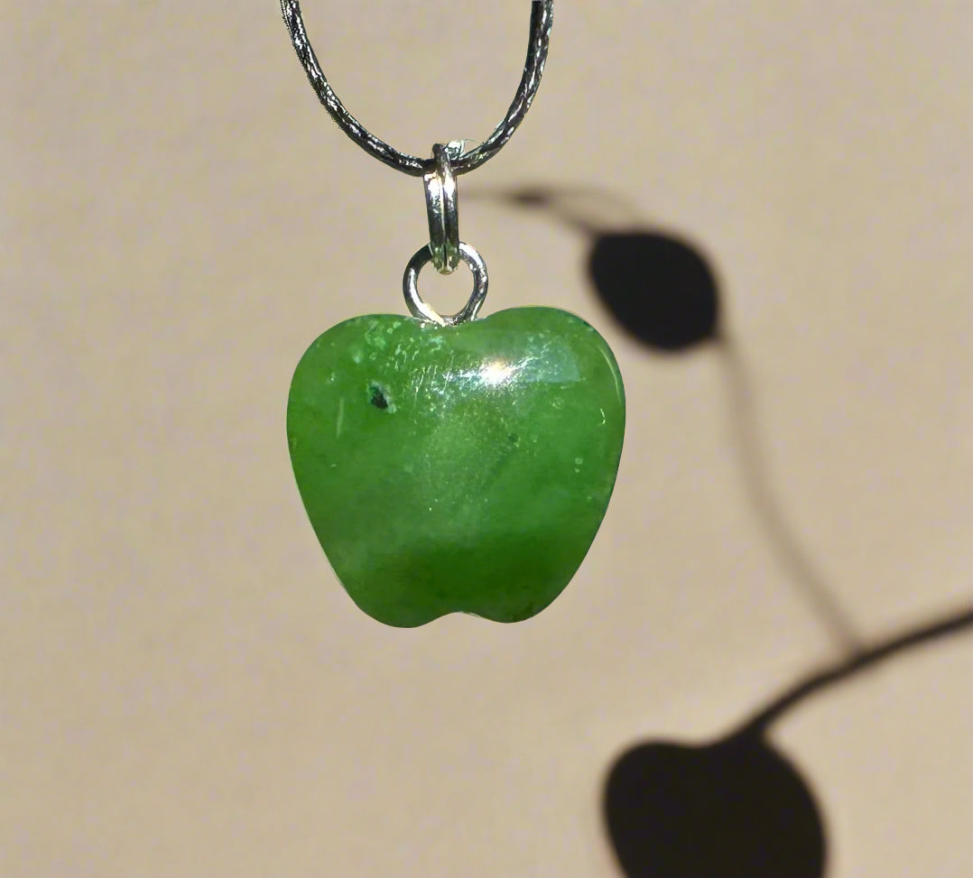 Green apple charm pendant 14mm hanging from a silver bail on a black cord necklace