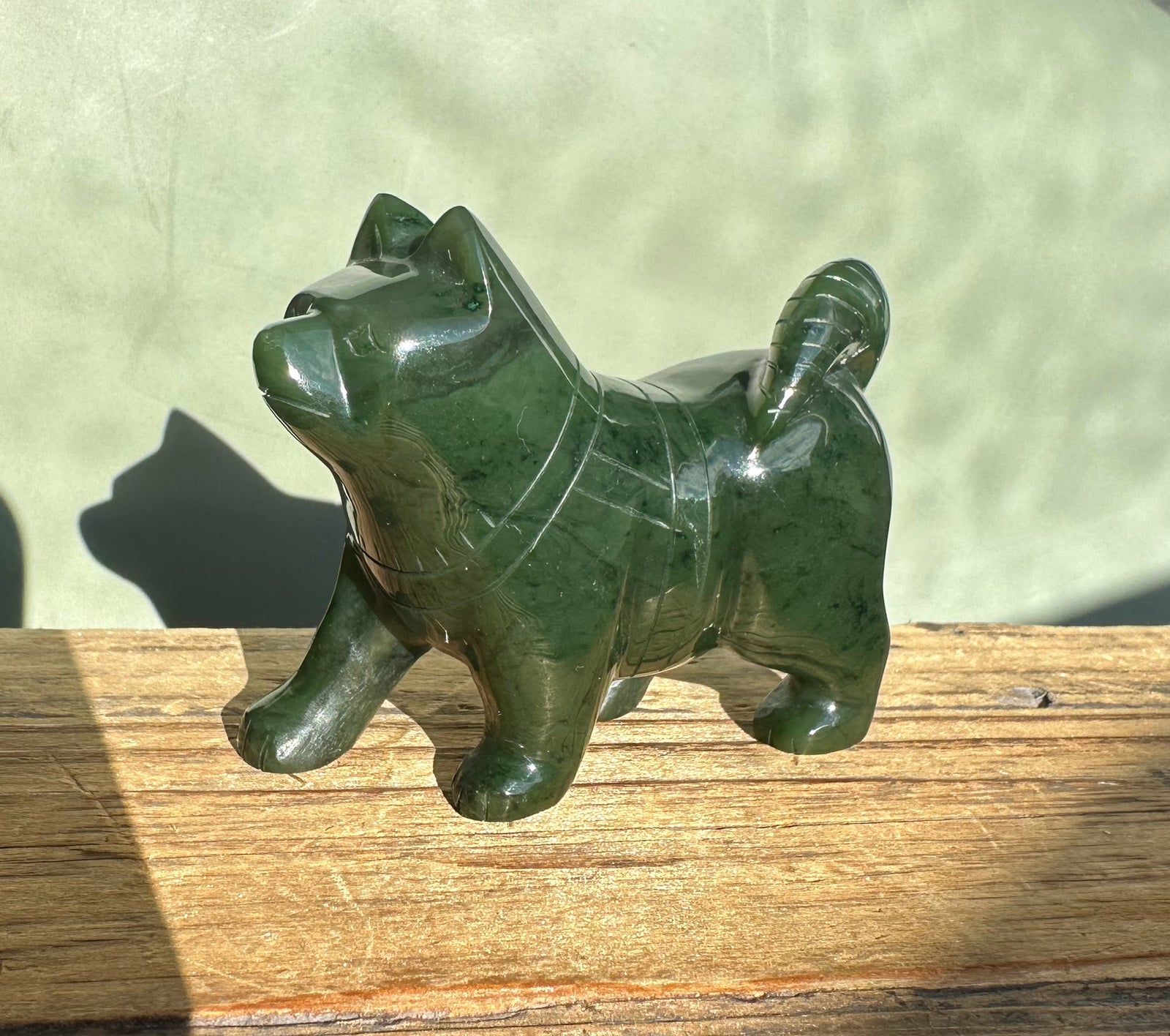 Canadian Jade Dog husky figurine carved from dark green jade, a 3-inch statue.