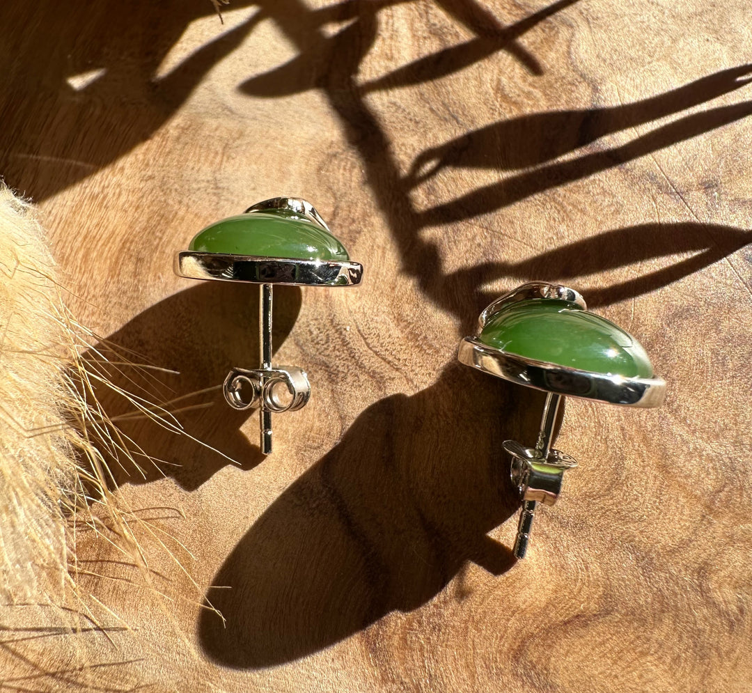 Green jade cabochon set in silver horse stud earring with butterfly back
