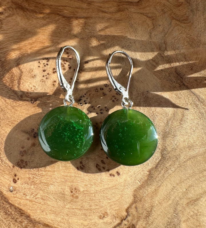 Pair of green jade disc earrings with silver lever-back clasps