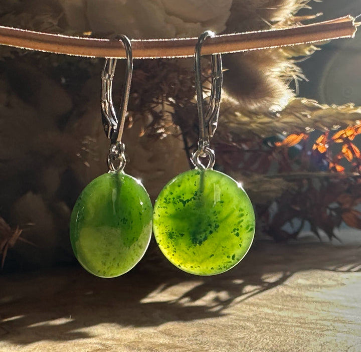 Green jade disc earrings with silver lever-back hooks