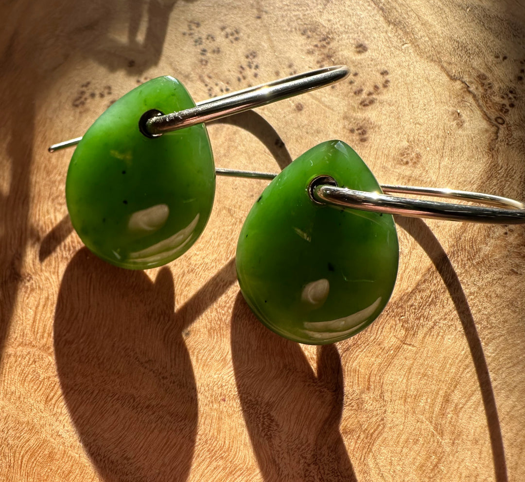Close-up of Canadian Jade Earrings showing lime green jade drops threaded on a silver hoop