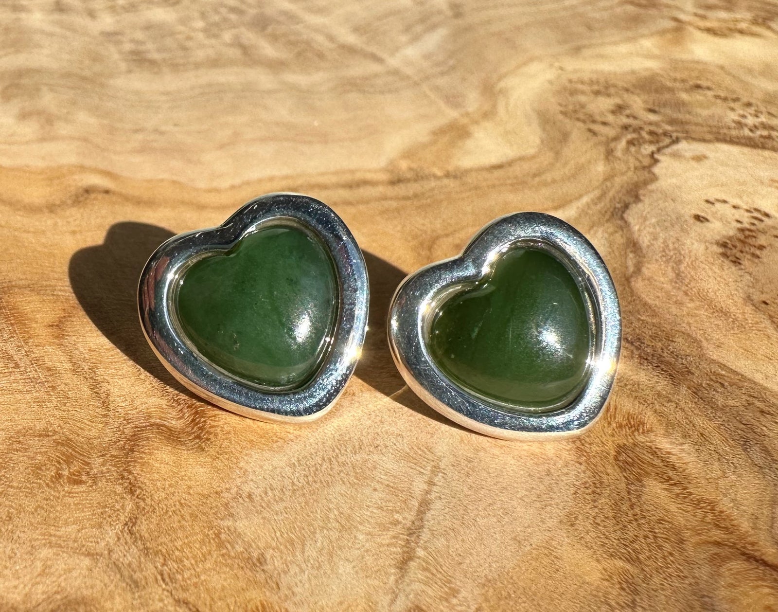 Pair of large silver heart earrings each with a green jade heart cabochon