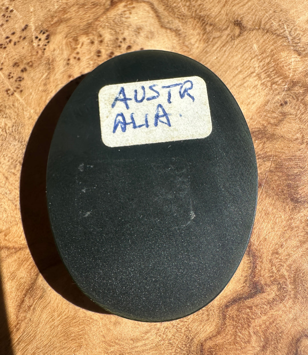 back side of the cab labeled Australia on a wooden surface
