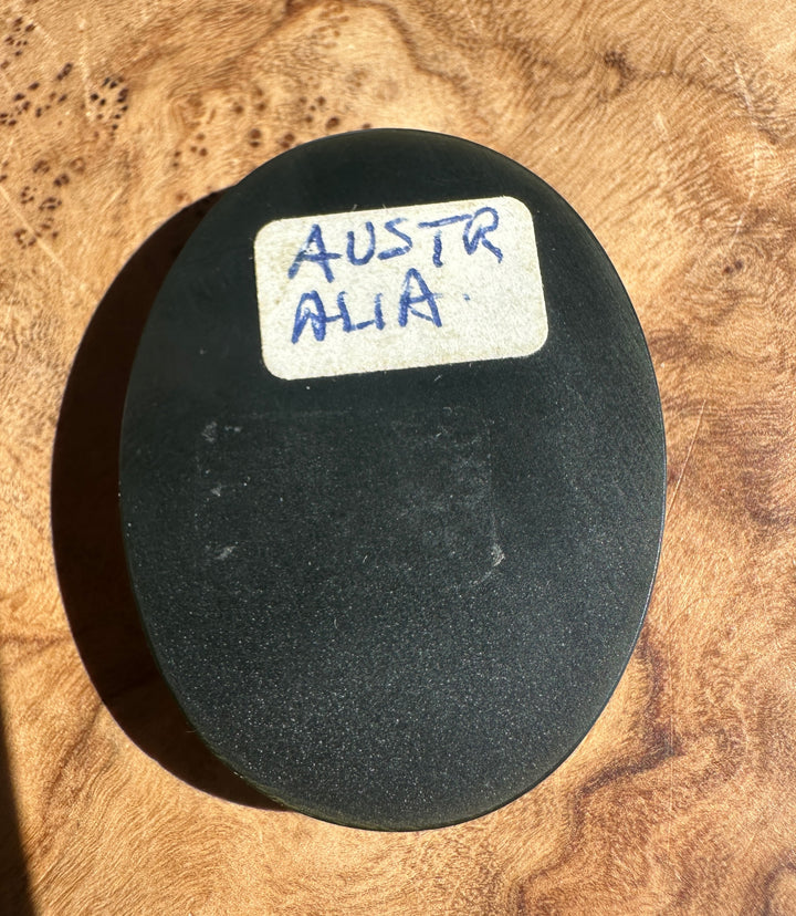 back side of the cab labeled Australia on a wooden surface