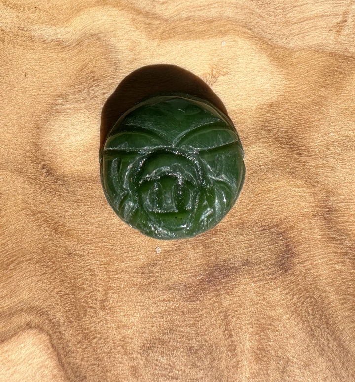 Vintage dark green jade rose cabochon 14mm with carved rose petals on tan suede fabric