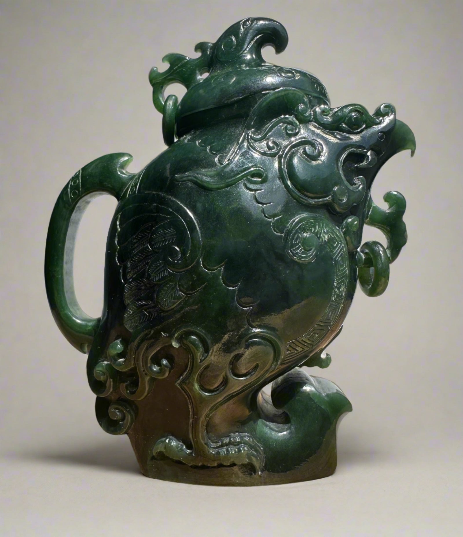 Dark green Canadian jade phoenix teapot with intricate raised carvings