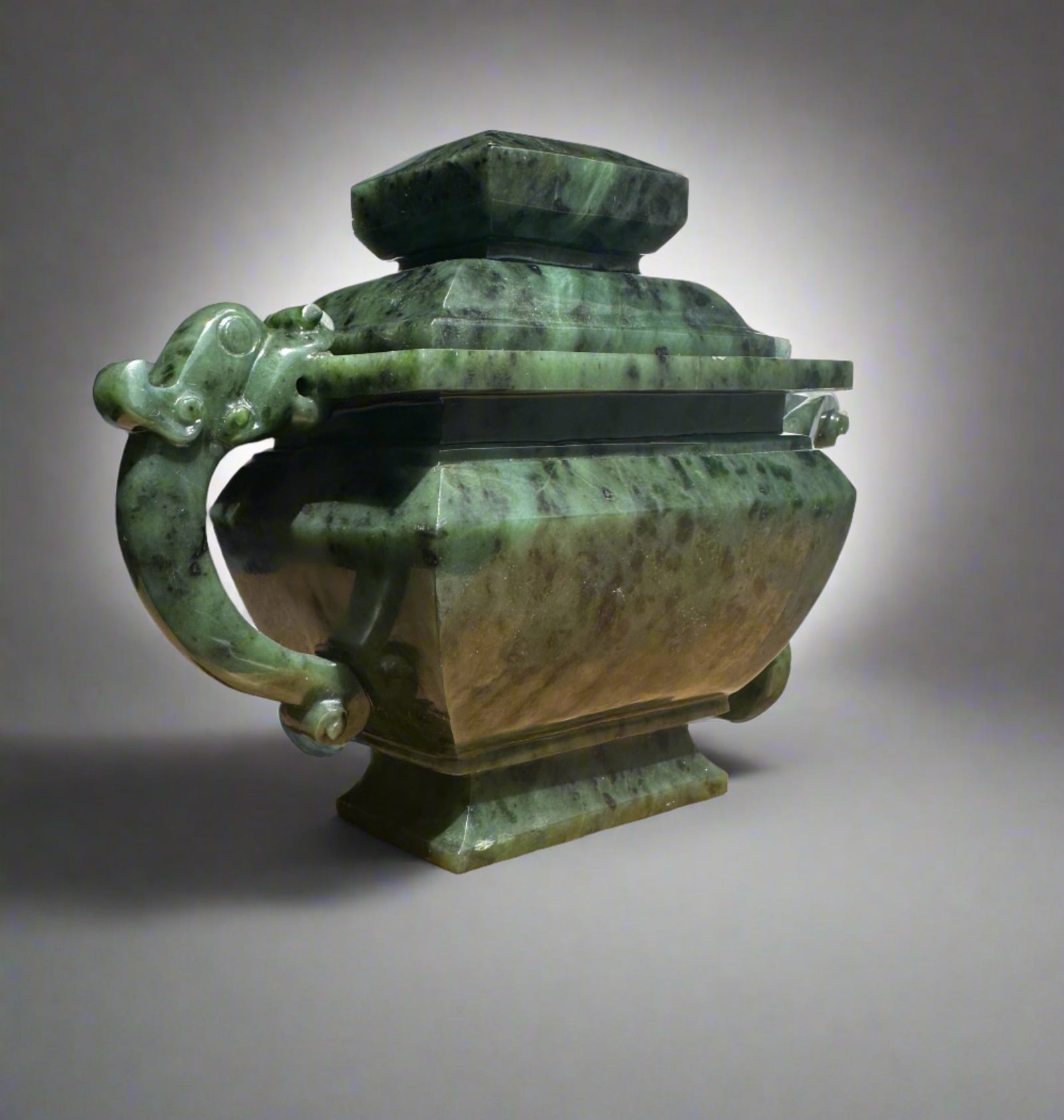 Canadian River Jade Teapot 6.75 inches shown in profile with marbled jade surface and decorative handles.