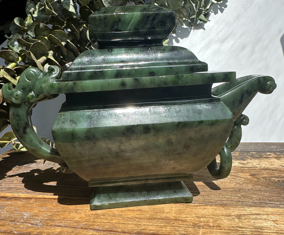 Canadian River Jade Teapot with lid, deep green jade body displayed on an ornate wooden stand