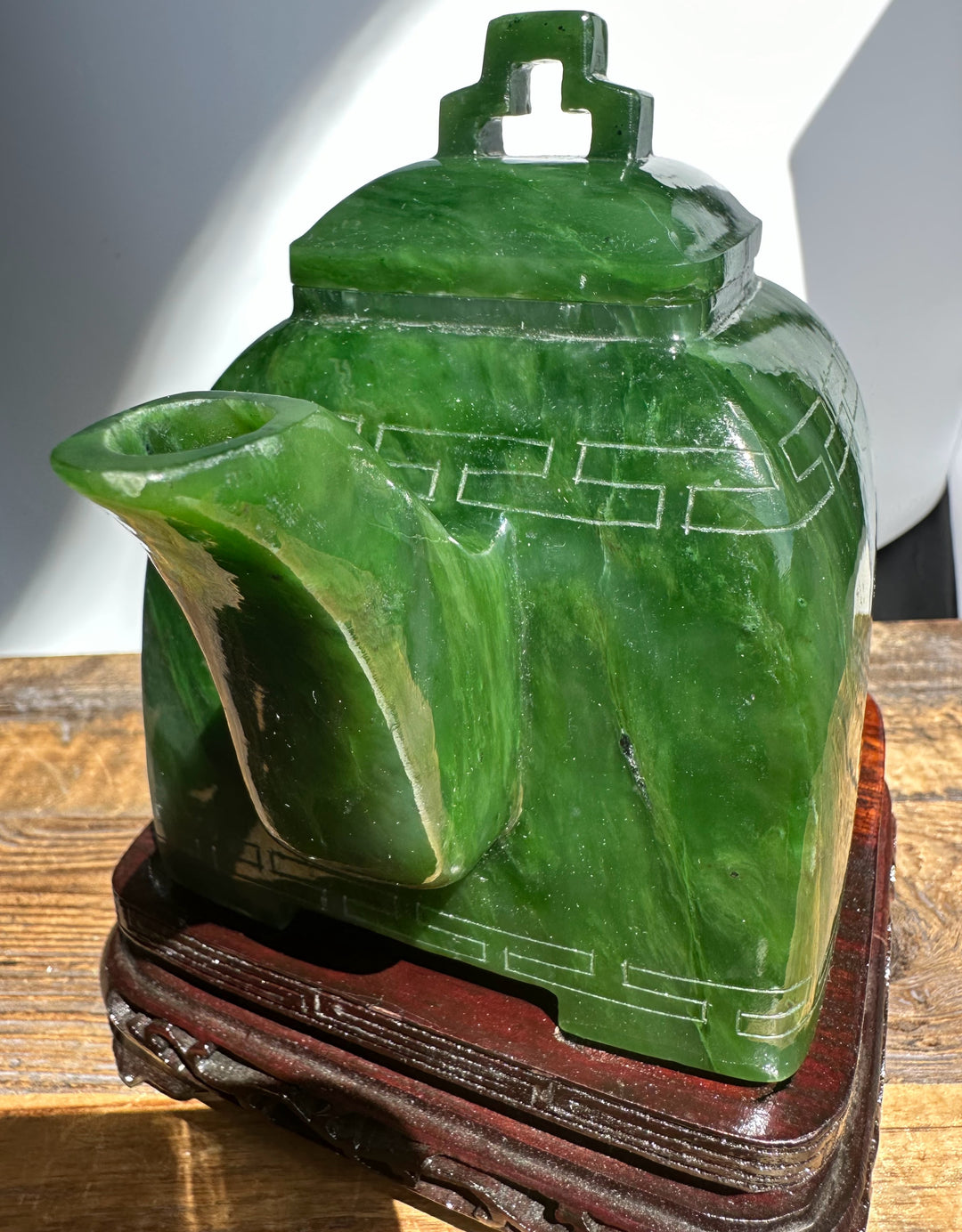 Side view of Polar Jade Teapot 7 focusing on the lid and spout with vivid green jade and decorative banding