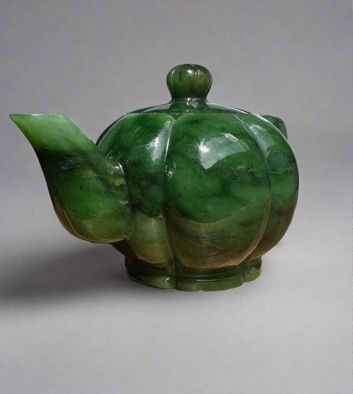 Polar Jade Teapot viewed from the side with a wide curved spout and glossy green jade glaze