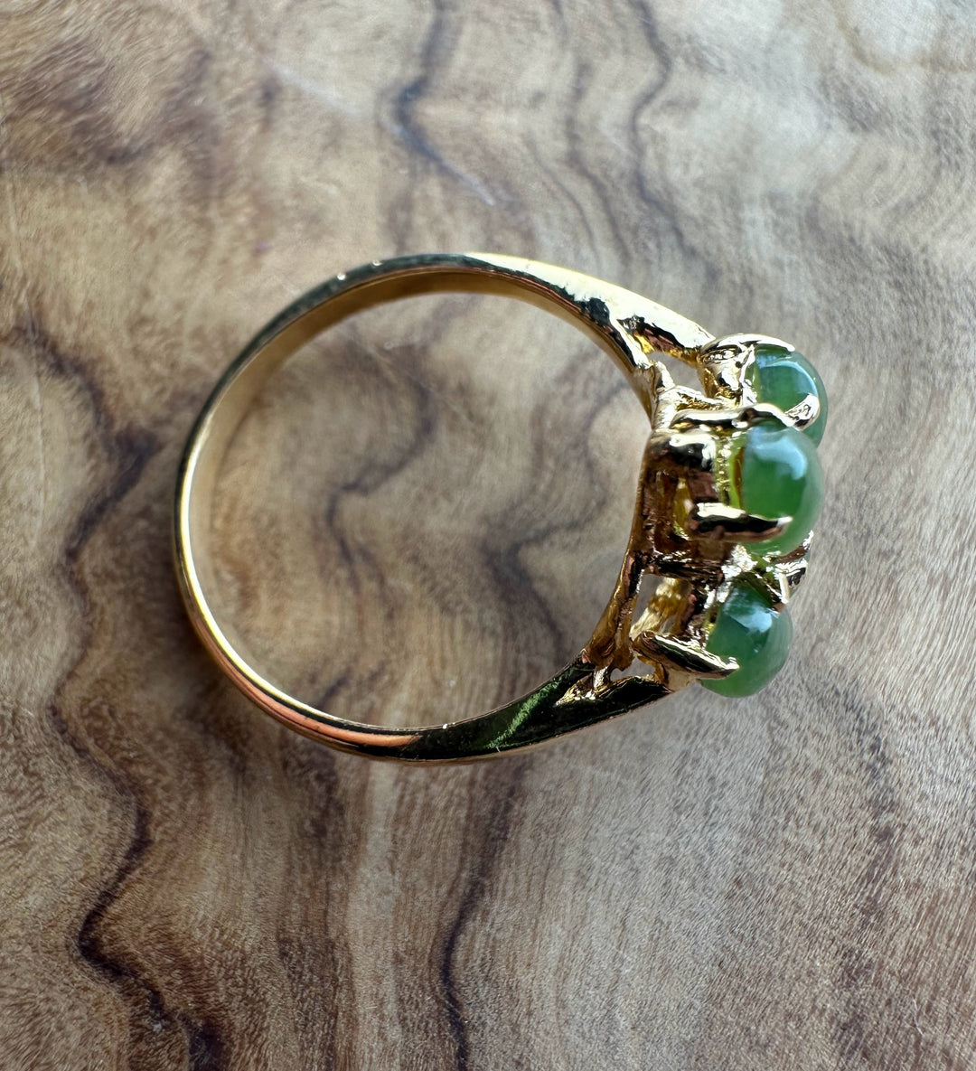 Vintage Canadian gold ring with a cluster of green jade stones on top