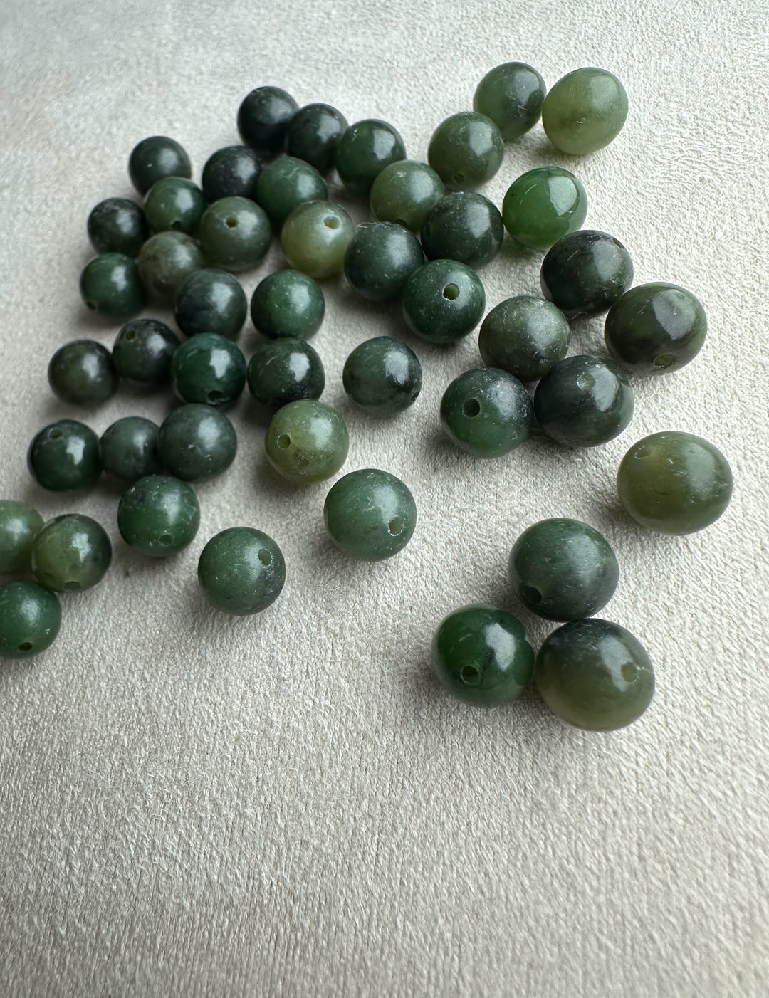 Natural Canadian nephrite jade beads 7-8.5mm with drilled holes in varying green shades
