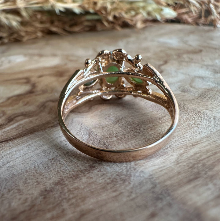 Back view of Vintage Jade Mask Ring showing ornate openwork silver band and prong settings