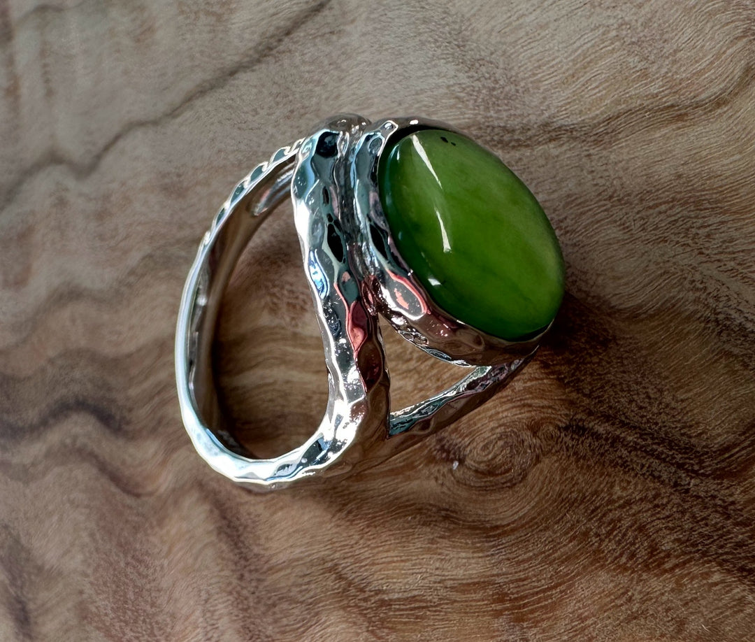 Angle view of Canadian Jade and Silver Ring featuring a green jade cabochon and a sculpted silver band.