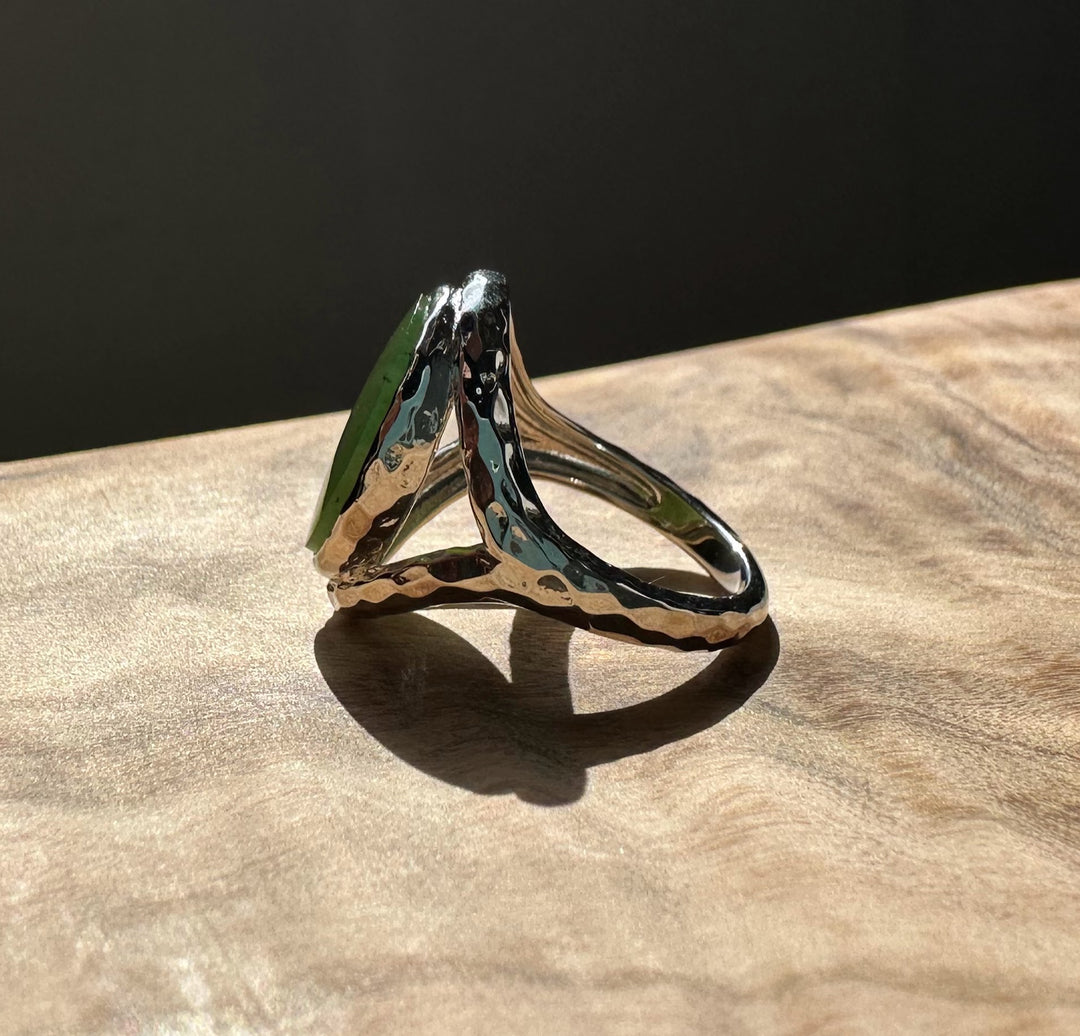 Side view of Canadian Jade and Silver Ring with a round green jade stone and a textured split silver band