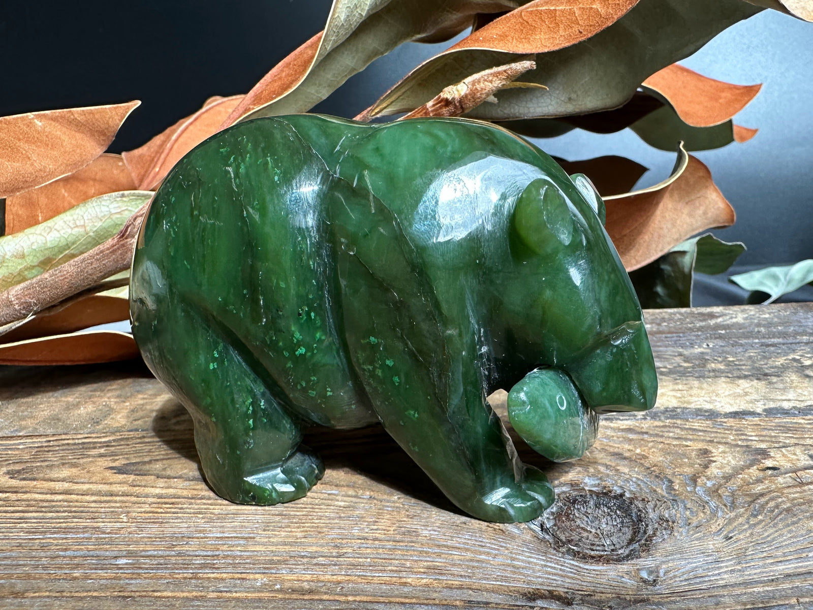 4 inch green jade bear with a jade fish in its mouth.