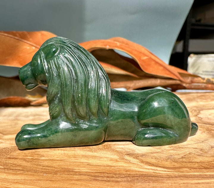 Side view of the 3 inch Canadian jade lion figurine showing its carved flowing mane.
