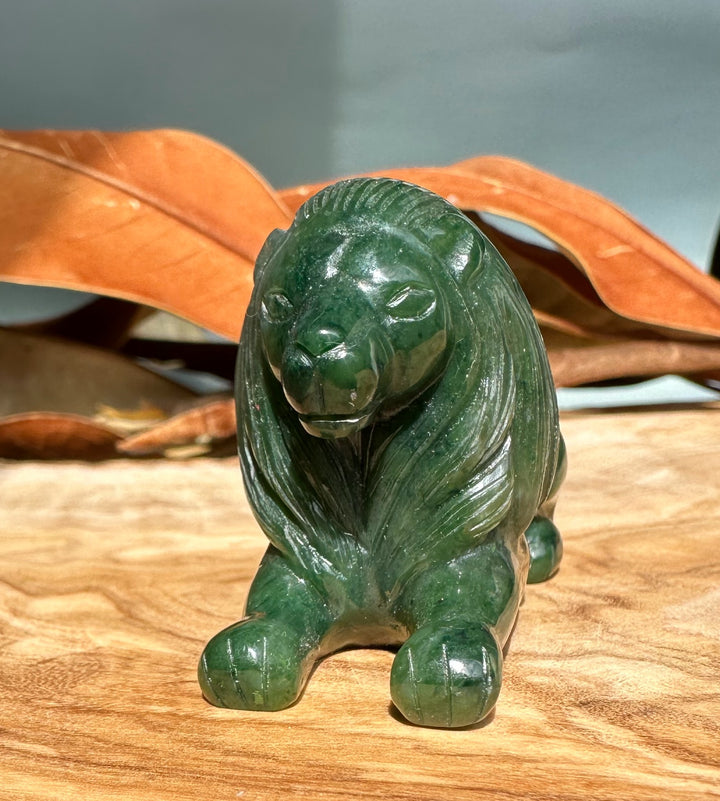 3 inch Canadian jade lion figurine with a glossy dark green finish and a carved mane.