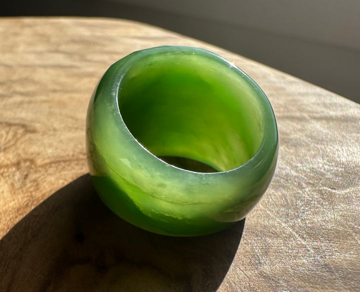 Interior view of the green jade ring showing a smooth bore and glossy surface
