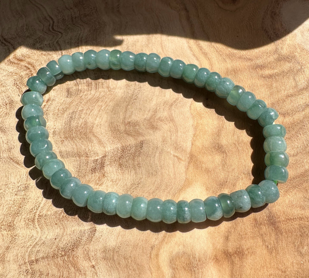 Pale green Guatemalan jadeite rondelle bracelet laid flat