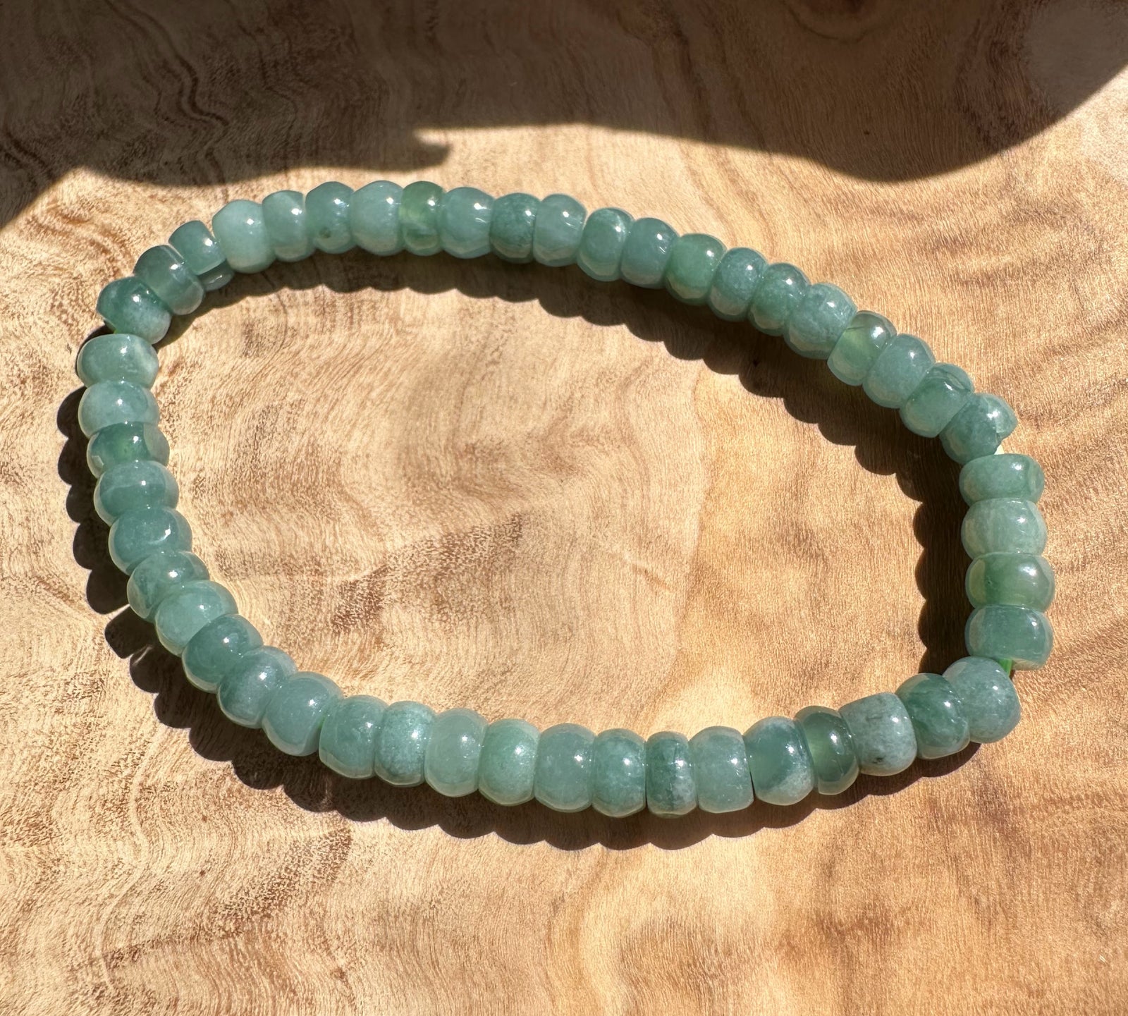 Pale green Guatemalan jadeite rondelle bracelet laid flat