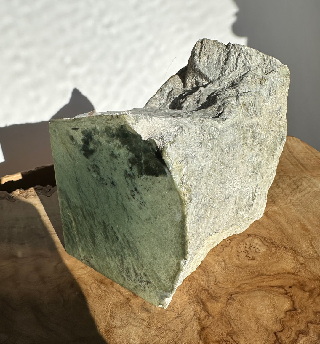 Wyoming Rough Jade block viewed from the side with a flat top and rugged edges